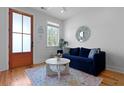 Cozy living room with a blue sofa, bright natural light and decor at 142 President St, Charleston, SC 29403