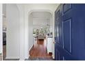 Welcoming entryway leads to a bright living room with hardwood floors and arched doorway at 1470 Ashley Gardens Blvd, Charleston, SC 29414