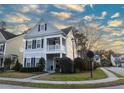 Beautifully landscaped two-story home featuring a covered front porch, manicured lawn and welcoming curb appeal at 1749 Towne St, Johns Island, SC 29455