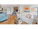 Cozy living room featuring hardwood floors and neutral coastal decor at 1984 Folly Rd # A310, Charleston, SC 29412
