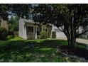 Well-maintained exterior with blue shutters, landscaped front yard, and a two-car garage at 2021 Asher Loop, Summerville, SC 29485