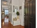 Inviting entryway boasting wood floors, decorative mirror, and stylish accents at 2064 Promenade Ct, Mount Pleasant, SC 29466