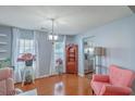 Cozy living room featuring hardwood floors, light blue walls, and natural light at 210 Delafield Dr, Summerville, SC 29483