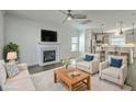 Bright living room featuring a fireplace, plush seating, and an open layout at 211 Saxony Loop, Summerville, SC 29486