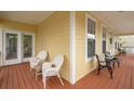 Expansive front porch provides ample seating with views of the surrounding neighborhood at 2267 N Marsh Dr, Mount Pleasant, SC 29466