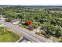 This aerial view shows the property's location near a road, surrounded by trees, and close to local amenities at 2373 Sorentrue Ave, North Charleston, SC 29405
