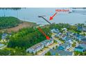 Stunning aerial view of a residential community with access to a private HOA dock on the water at 2402 Brackish Dr, Mount Pleasant, SC 29466