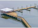 A beautiful covered dock offers the opportunity to enjoy calm waters and the outdoors at 2402 Brackish Dr, Mount Pleasant, SC 29466