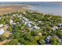 Expansive aerial view of a waterfront community with charming houses and marsh views at 301 Center St, Mount Pleasant, SC 29464