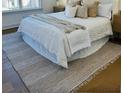 Cozy bedroom featuring a comfortable bed, a plush rug, and natural light from the window at 405 Oak Hammock Ct # 49, Johns Island, SC 29455