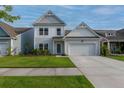 Charming two-story home with an attached two-car garage, well-manicured lawn, and beautiful curb appeal at 408 Fox Sparrow Ct, Summerville, SC 29486