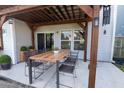 Outdoor patio featuring a wooden pergola and dining set, perfect for entertaining and relaxing at 408 Fox Sparrow Ct, Summerville, SC 29486
