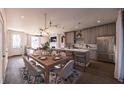 Bright open-concept area with a modern kitchen, dining space, and cozy living room with seamless flow at 409 Oak Hammock Ct # 50, Johns Island, SC 29455
