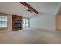 Bright living room with a brick fireplace, vaulted ceiling and abundant natural light at 441 Compton Dr, Moncks Corner, SC 29461
