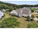 Aerial view of a charming one story home, with well maintained lawn and landscaping, near a pond at 528 Sea Foam St, Summerville, SC 29486