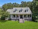 Beautiful home with a covered front porch, perfect for enjoying the outdoors at 820 Old Cordesville Rd, Moncks Corner, SC 29461