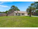 Inviting single-story home with a lush green lawn and mature trees providing shade at 106 Brown Ct, Summerville, SC 29486