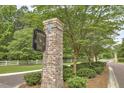 Welcome to Carolina Bay, an upscale community entrance with brick signage and lush landscaping at 1088 Deep Gap Rd, Ridgeville, SC 29472