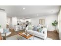Bright, open-concept living room seamlessly flows into the kitchen and dining area, perfect for entertaining at 133 Haventree Ct, Summerville, SC 29486
