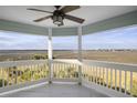 Enjoy this covered patio offering picturesque marsh views in a relaxing outdoor space at 138 W Mariners Cay Dr, Folly Beach, SC 29439