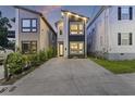 Contemporary home showcasing a stylish facade, prominent windows, and a spacious driveway at 14 F St # B, Charleston, SC 29403