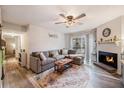 A cozy living room featuring a fireplace, plush seating, and lots of natural light at 1402 Camp Rd # 9G, Charleston, SC 29412