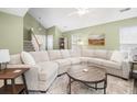 Spacious living room with vaulted ceilings, large sectional sofa, and open layout at 1813 Parkland Preserve Ln, Charleston, SC 29412