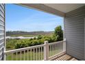 Charming balcony view of marsh and river at 185 Winding River Dr, Johns Island, SC 29455