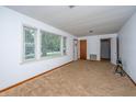 Neutral living room features carpet, a large window, and simple trim at 2567 Mona Ave, Charleston, SC 29414