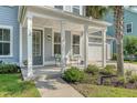 Inviting front porch with comfortable seating, charming details, and a warm, welcoming ambiance at 2652 Private Lefler Dr, Johns Island, SC 29455