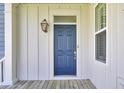 Inviting front door entrance with a classic lantern and detailed trim work for a warm and stylish welcome at 2820 Merriams Dr, Charleston, SC 29414