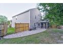 Backyard featuring a brick patio, wood privacy fence, and air conditioning unit near the screened porch at 3009 Mapleleaf Dr, Moncks Corner, SC 29461