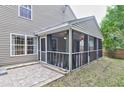 The home features a screened-in porch with curtains, brick flooring, and an adjacent patio at 3009 Mapleleaf Dr, Moncks Corner, SC 29461