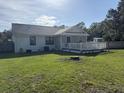 Spacious backyard with a wooden deck, perfect for outdoor entertaining and relaxation at 304 Carolina Cir, Walterboro, SC 29488