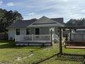 Lovely backyard featuring a deck, above ground pool, and swing set for outdoor enjoyment at 304 Carolina Cir, Walterboro, SC 29488