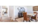 Dining room featuring a table, four chairs, buffet, and wood floors in neutral colors at 325 Willow Run Dr, Summerville, SC 29486