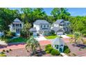 An aerial view of a neighborhood showcasing beautiful homes and lush greenery at 3285 Johnstowne St, Johns Island, SC 29455