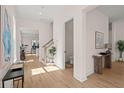 Open foyer with views to living area and powder room, showcasing hardwood floors at 3285 Johnstowne St, Johns Island, SC 29455