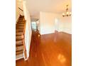 Inviting living room with gleaming hardwood floors, crown molding, and lots of natural light at 332 Southern Sugar Ave, Moncks Corner, SC 29461