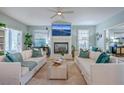 Cozy living room featuring a fireplace, stylish furnishings, and ample natural light at 3805 Adrian Way, Mount Pleasant, SC 29466