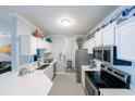 Bright kitchen with white cabinets, stainless steel appliances, and a functional layout perfect for cooking at 45 Sycamore Ave # 611, Charleston, SC 29407