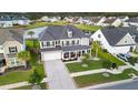 Spacious two-story home in a Gathering-friendly neighborhood, boasting lush lawns and serene pond views at 451 Spectrum Rd, Summerville, SC 29486