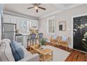 Inviting living area with hardwood floors, stylish decor, an eat-in kitchen and plenty of light at 5 1/2 Kracke St # A, Charleston, SC 29403