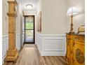 Elegant entryway with beautiful wood floors and decorative molding at 105 Harbor Trace Ln, Summerville, SC 29486