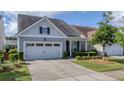 Charming home with a well-manicured front yard and an attached two-car garage at 105 Harbor Trace Ln, Summerville, SC 29486