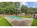 Large in-ground pool with a detached garage, perfect for relaxation and entertainment at 114 Stewart St, Goose Creek, SC 29445