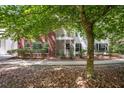 Back exterior of condo unit featuring a screened patio and balcony at 115 Golfview Ln, Summerville, SC 29485