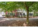 Back exterior of condo unit featuring a screened patio and balcony at 115 Golfview Ln, Summerville, SC 29485