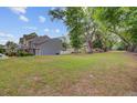 Expansive backyard with mature trees, offering a serene outdoor space at 117 Macy Cir, Goose Creek, SC 29445