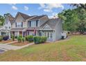 Charming two-story townhome with well-maintained landscaping and inviting front entrance at 117 Macy Cir, Goose Creek, SC 29445
